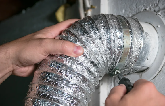 installing-the-flexible-vent-hose-behind-the-dryer