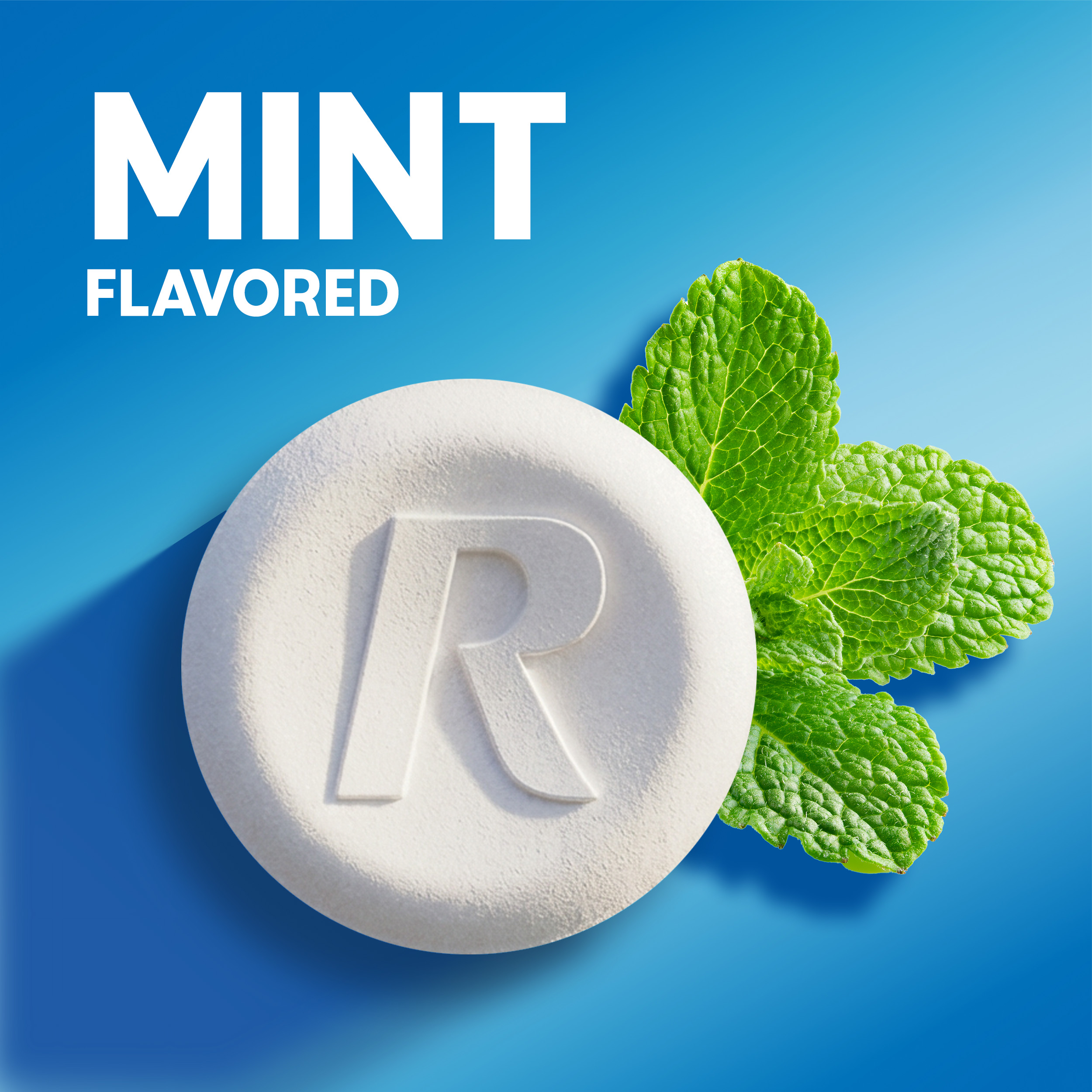 White Rolaids chewable tablet embossed with an "R" next to fresh green mint leaves, with text reading "MINT FLAVORED" on a blue background.