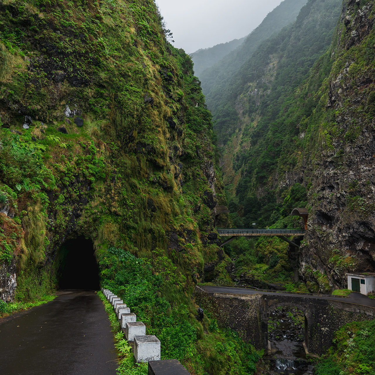 The old road and two-way tunnel on the North coast of Madeira. Some of the older roads are in a very bad state and closed, but this one was open for traffic.