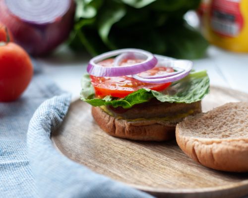 turkey burger with onion tomato and lettuce
