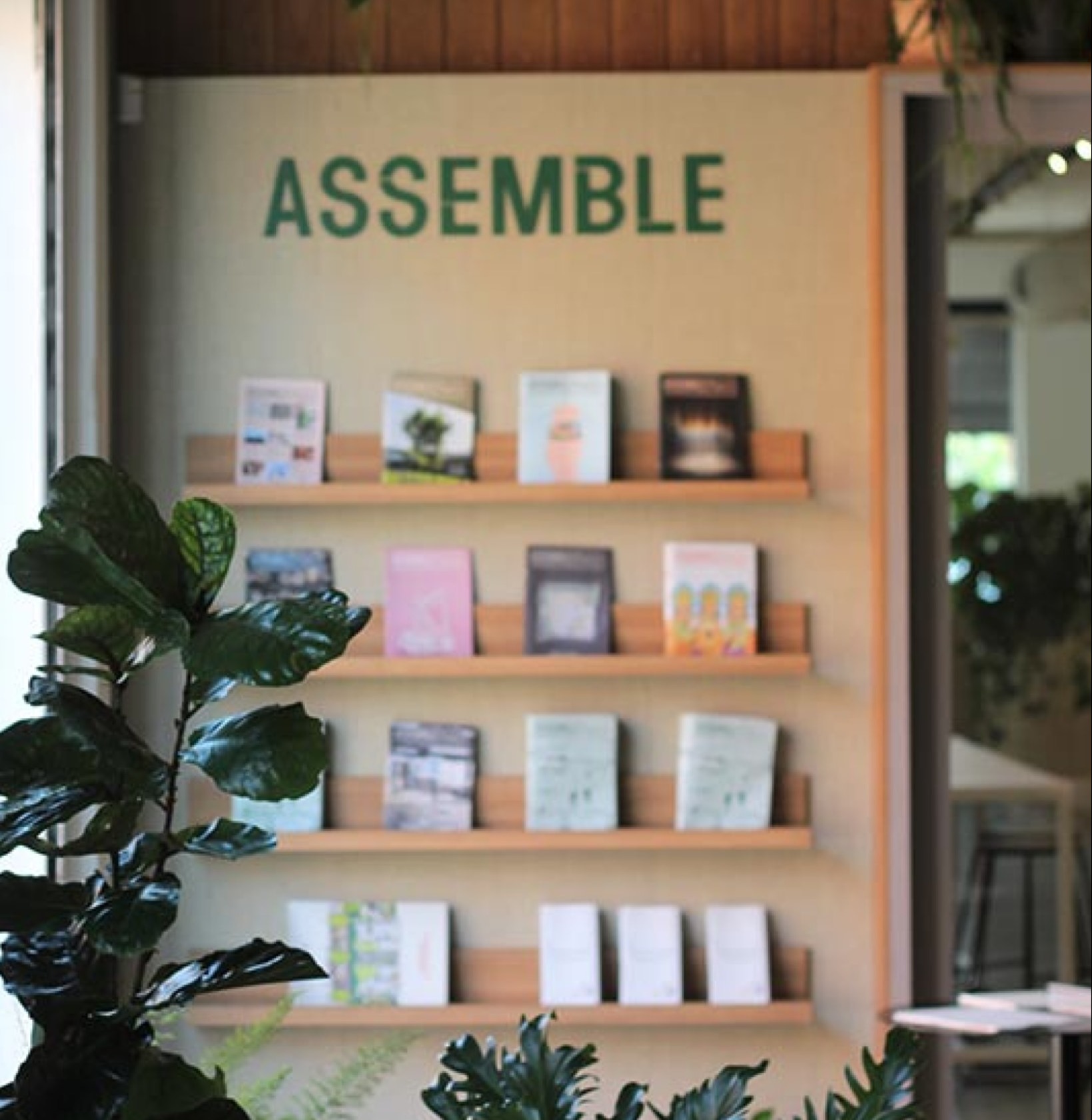 A bookshelf at the Assemble studio with copies of Assemble Papers
