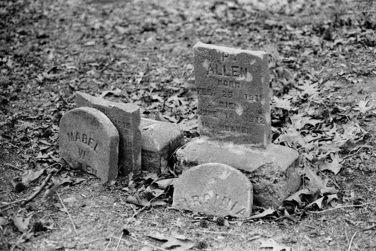 A cluster of broken headstones in Geer Cemetery, a historic Black cemetery in Durham, North Carolina. Photo: Ra'il I'Nasah Kiam.