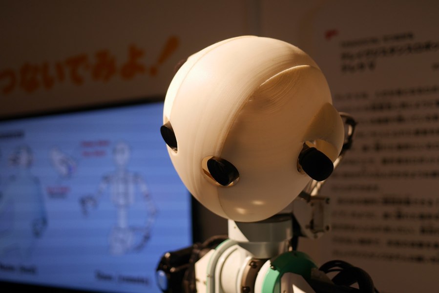 A photo of the head and upper torso of a robot.