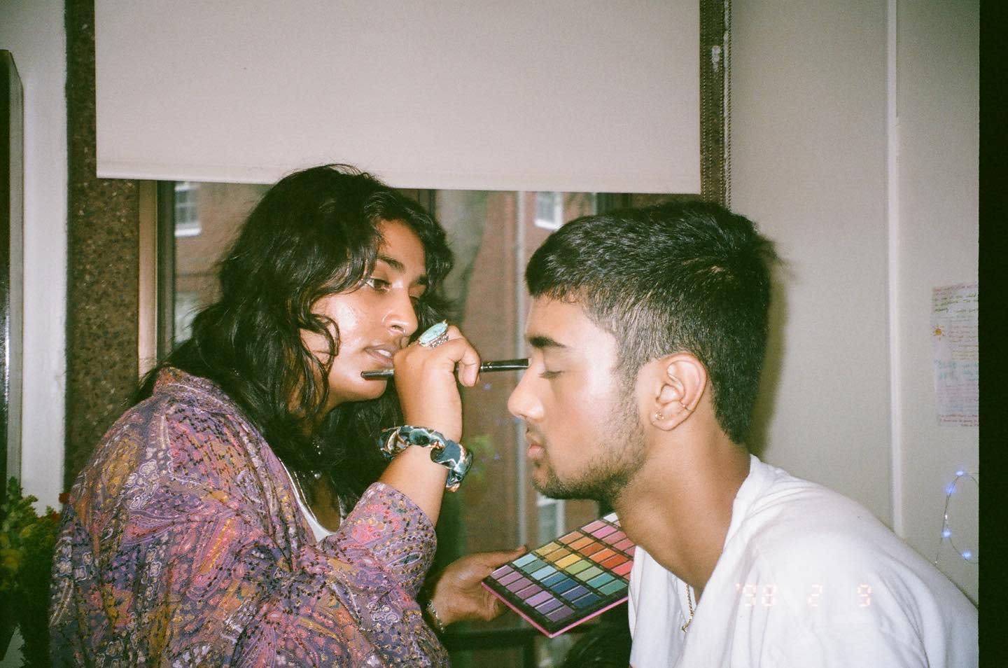 Bhargavi Garimella putting eye makeup on me.