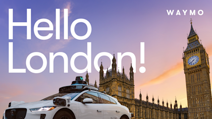 A Waymo Jaguar I-PACE set against a sunset sky, Big Ben and the Palace of Westminster