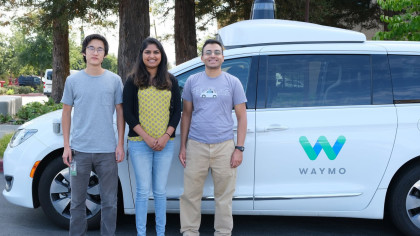 A photo of William, Alisha, and Khaled in front of a white, Waymo Pacifica minivan