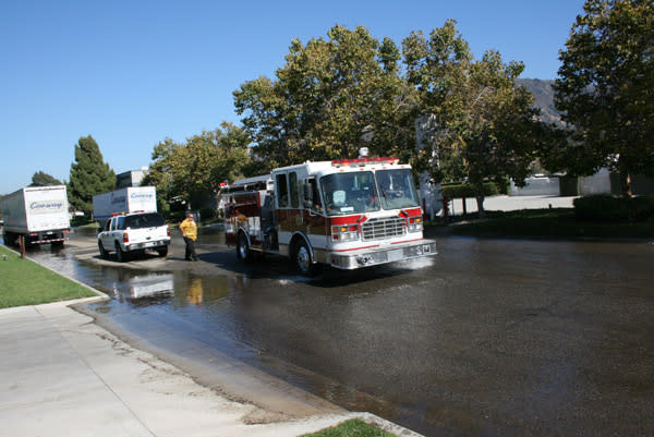 Fire Truck Responding To Street Water Main Break