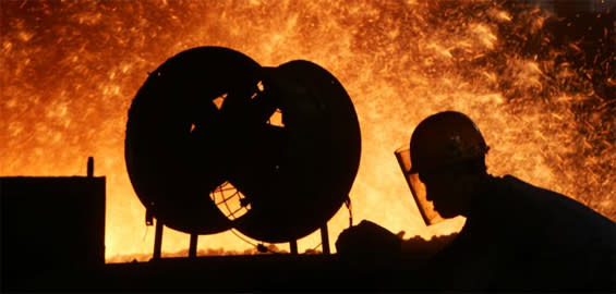 Steel Manufacturing Worker Near Molten Metal Furnace