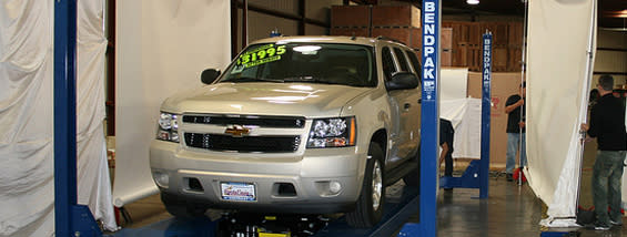BendPak Four Post Lift Display With SUV At Trade Show