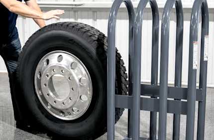 Ranger tire inflation safety cage containing a mounted truck tire for secure inflation procedures.