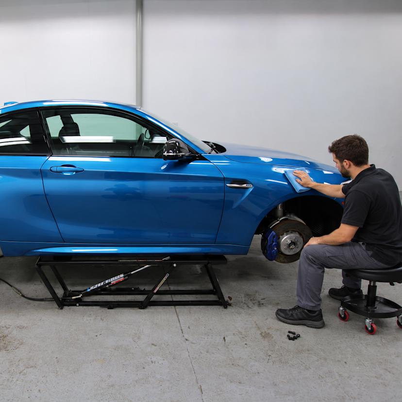 QuickJack portable car lift for auto detailing