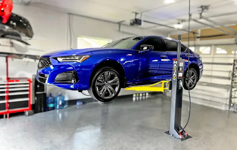 Blue-car-MaxJax-portable-two-post-Lift-in home-garage
