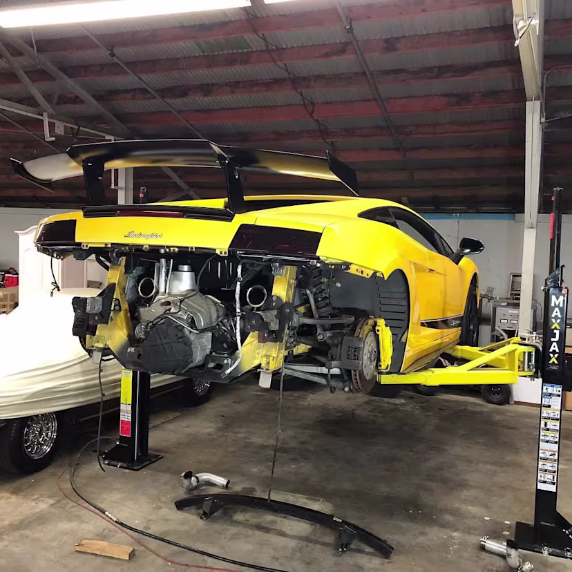 maxjax-portable-car-lift-two-post-5175548-lamborghini-semi-industrial-garage-lifted-01