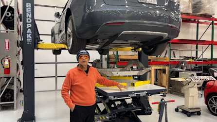 BendPak EV4000 Scissor Lift With Vehicle On Two Post Lift at Gruber Motors