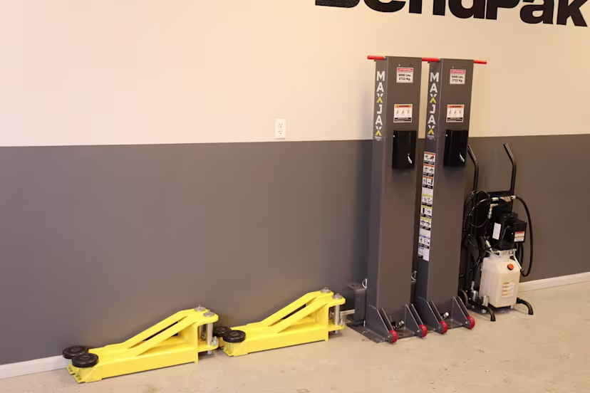 maxjax-portable-car-lift-two-post-5175548-stowed-away-against-wall-storage-01