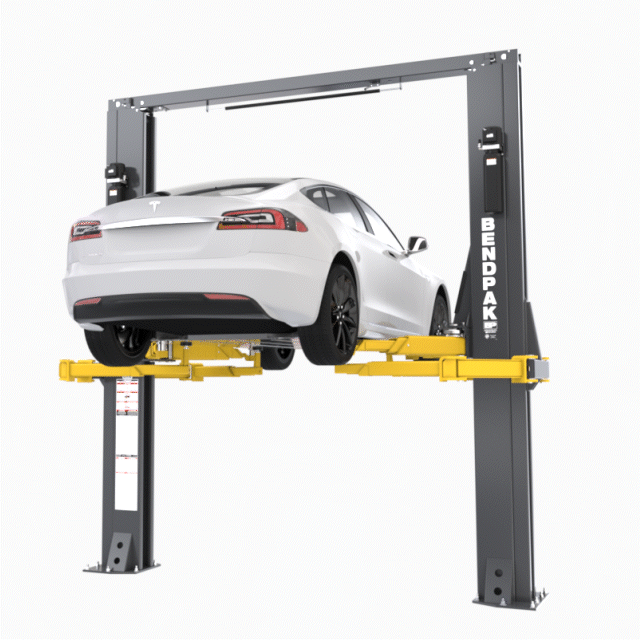 BendPak OctaFlex Two Post Lift Raising Tesla EV in Auto Shop