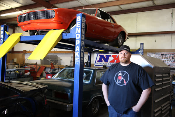 BendPak Four Post Lift With Classic Camaro In Garage