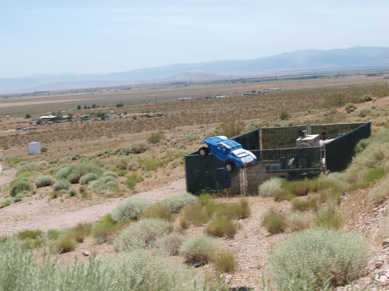 Wrecked Car On Desert Hill Crash Scene
