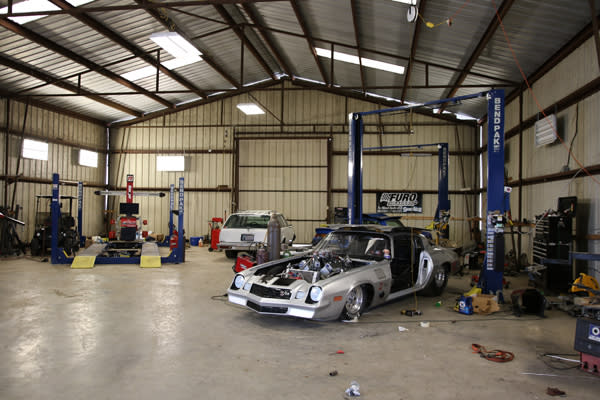 Professional Auto Shop With BendPak Car Lifts And Race Cars