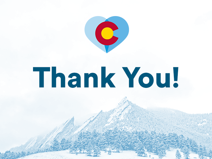 A heart overlaid on the Colorado flag with the Boulder Flatirons in the background with Thank you spelled out
