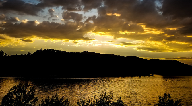 A sunset reflecting in a mountain lake