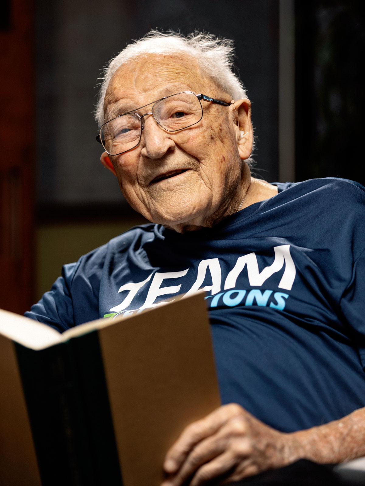 Elder Member of Elevations Reading a book