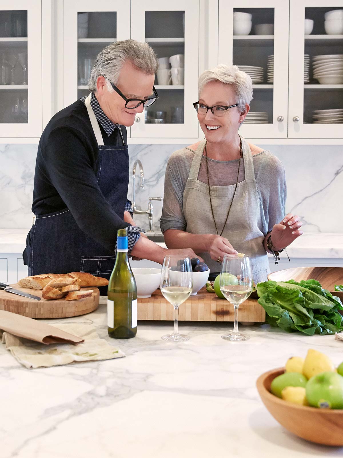 Husband and wife cook together in their newly remodeled kitchen