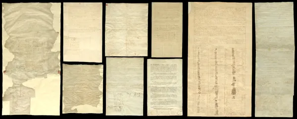 Seven yellowed old papers with faint writings on them, placed on a black background 