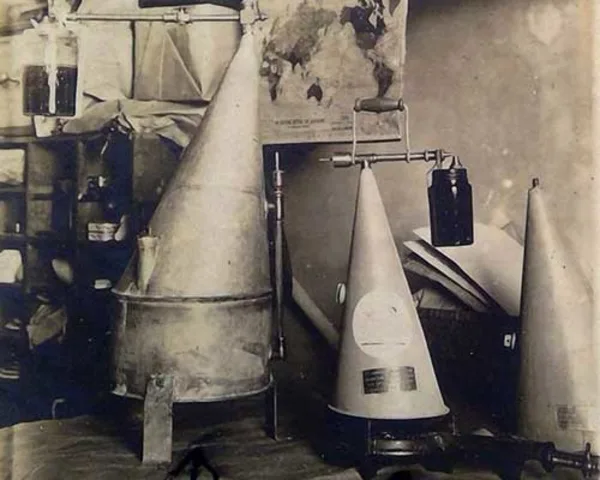An inhalation station featuring cone shaped contraptions with various jars attached to them.