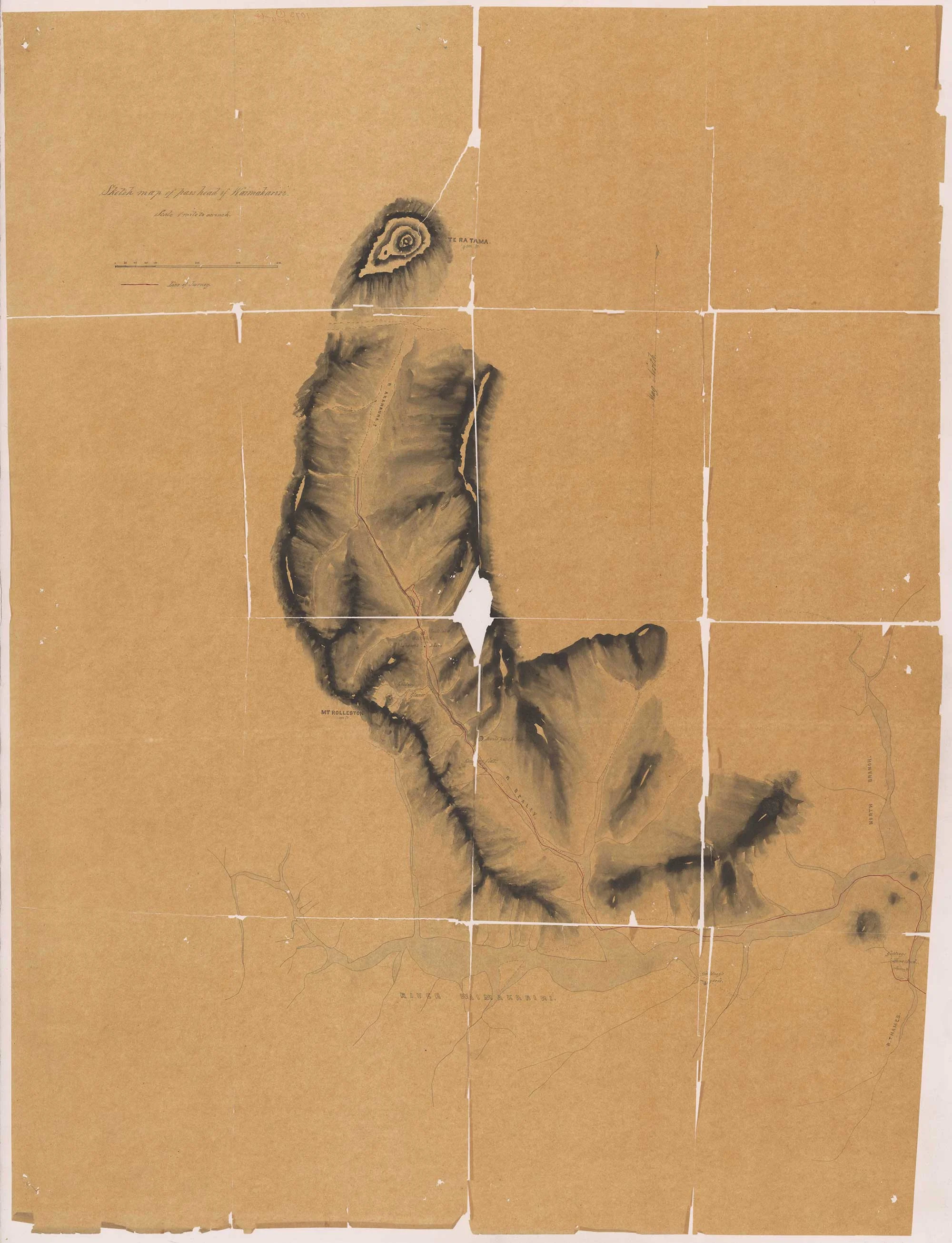 An old map on a brown paper torn in some places