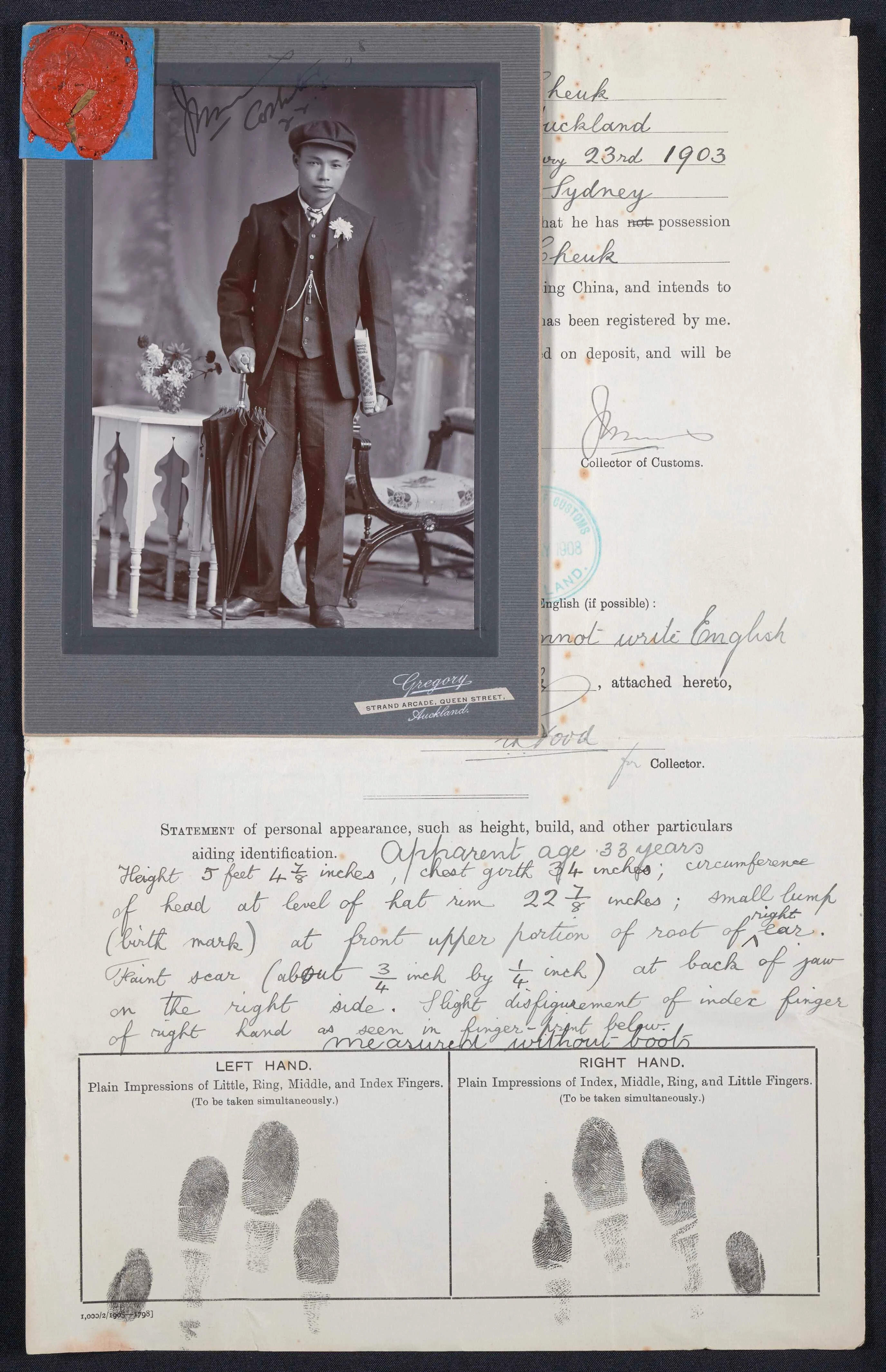 An old handwritten letter with a black and white photo of an old man attached