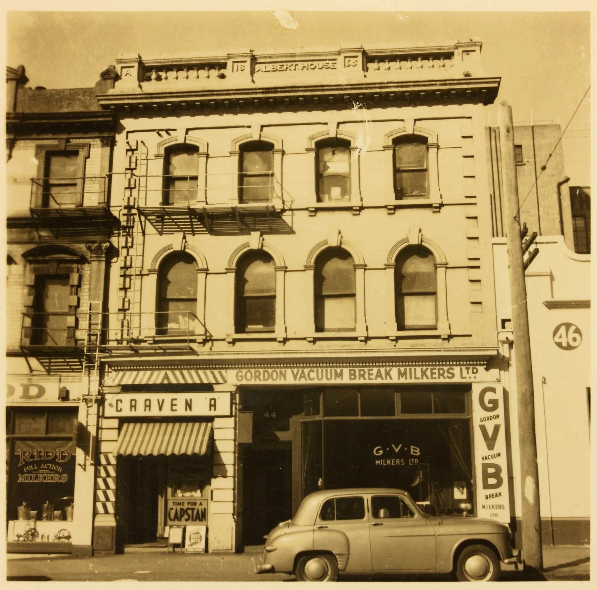 A sepia shot of a building from the street