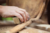 Sanding a piece of old wood. Sanding a piece of old wood.