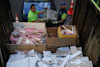 Loading construction waste onto waste removal truck. Loading construction waste onto waste removal truck.