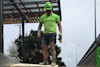 Team member on a demolition waste removal truck Team member on a demolition waste removal truck