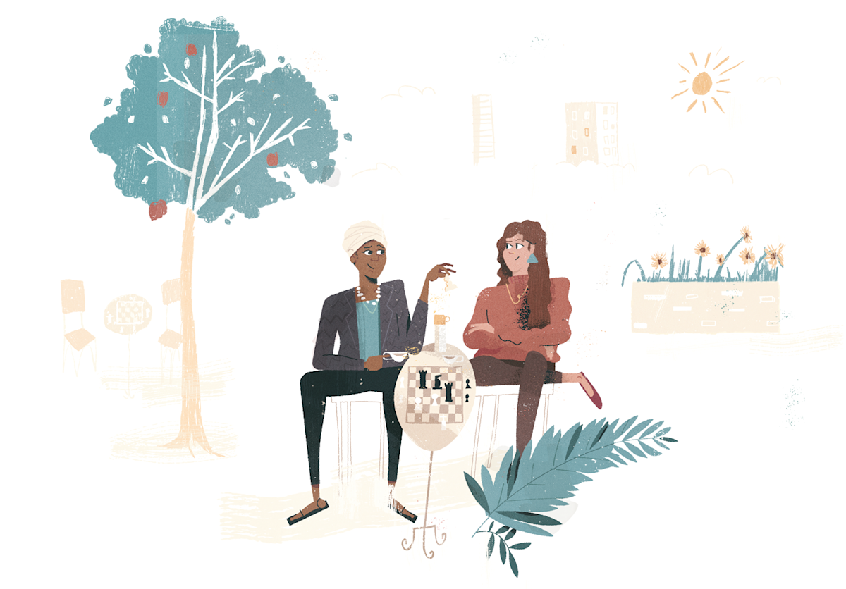 Two people sitting in a park playing chess