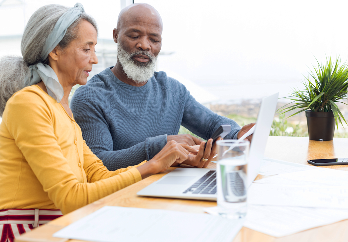 Couple doing paperwork together at a table