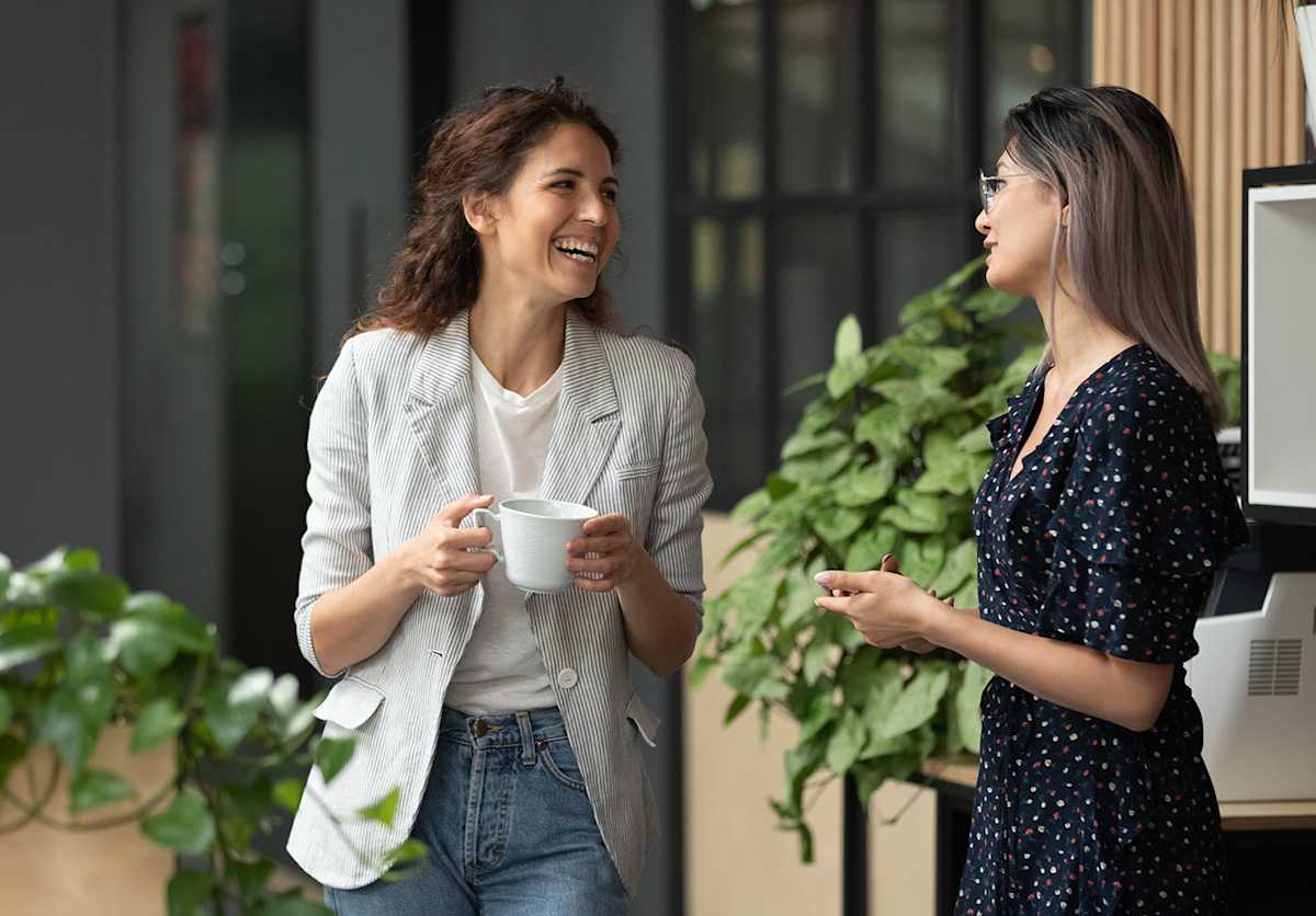 Two colleagues chatting in the workplace