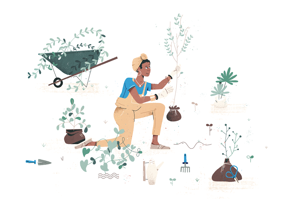 Gardener wearing overalls with wheelbarrow, tools and greenery