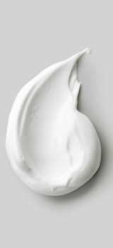 a chunk of cream on a grey surface