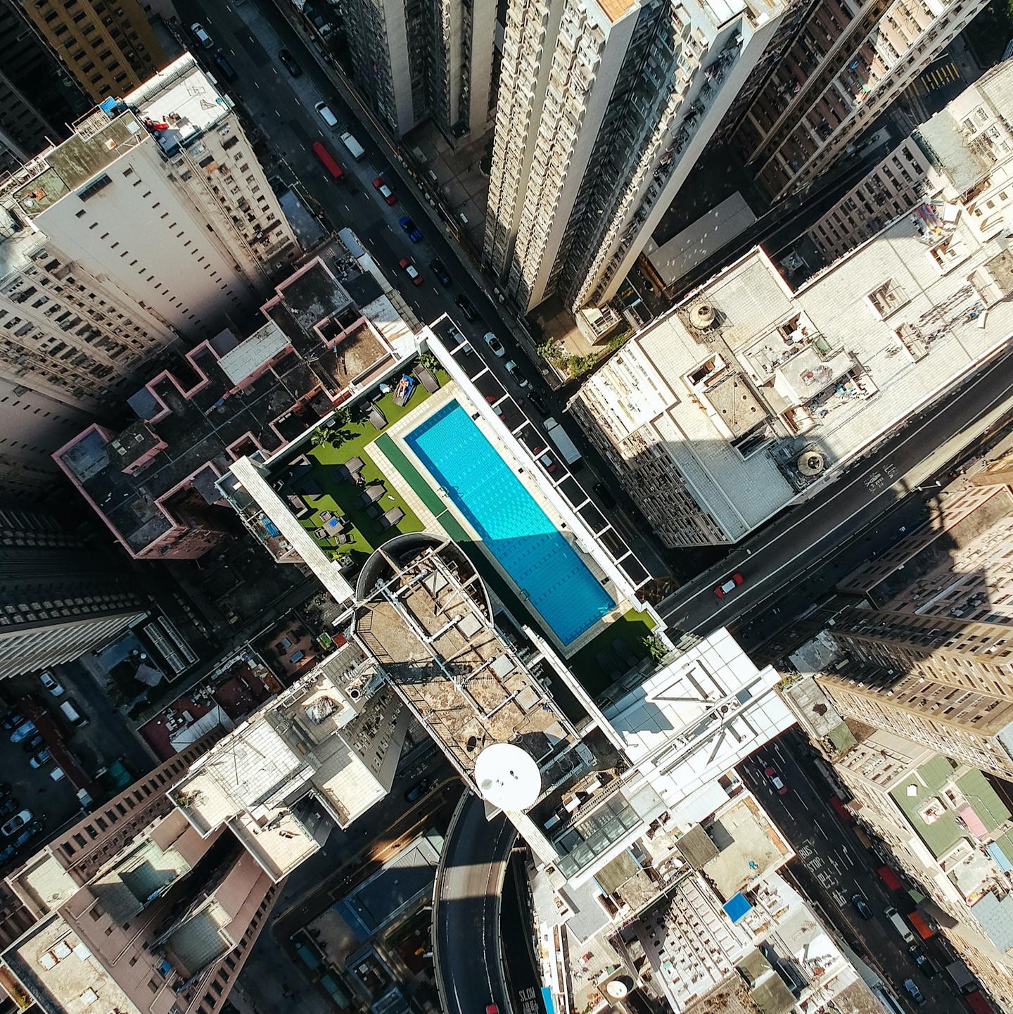 aerial shot of city and pool