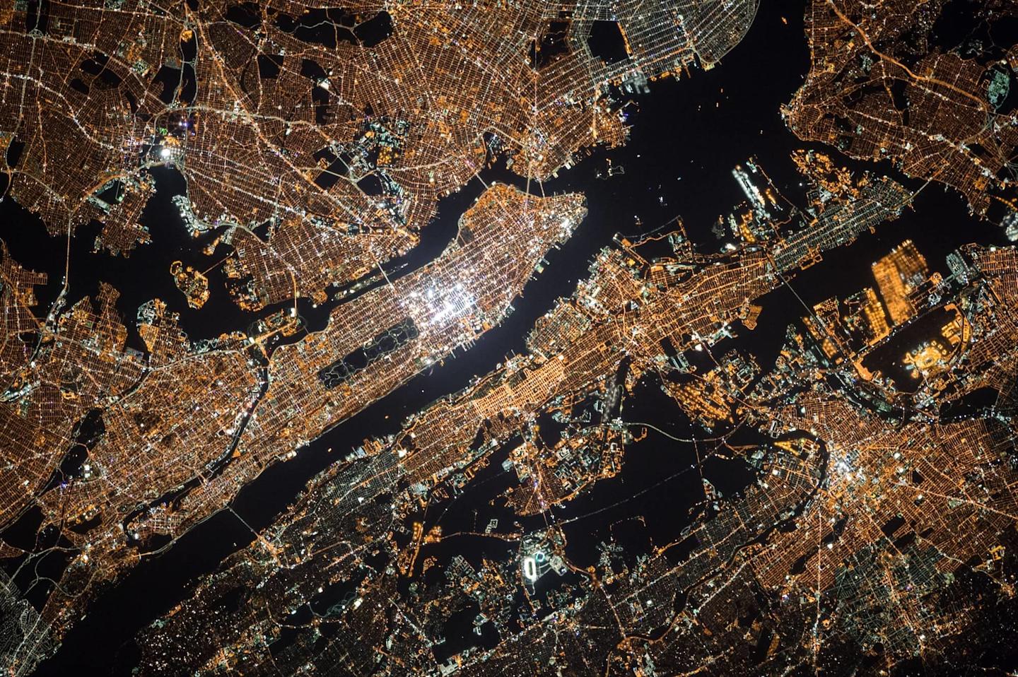 view of nyc at night with lights