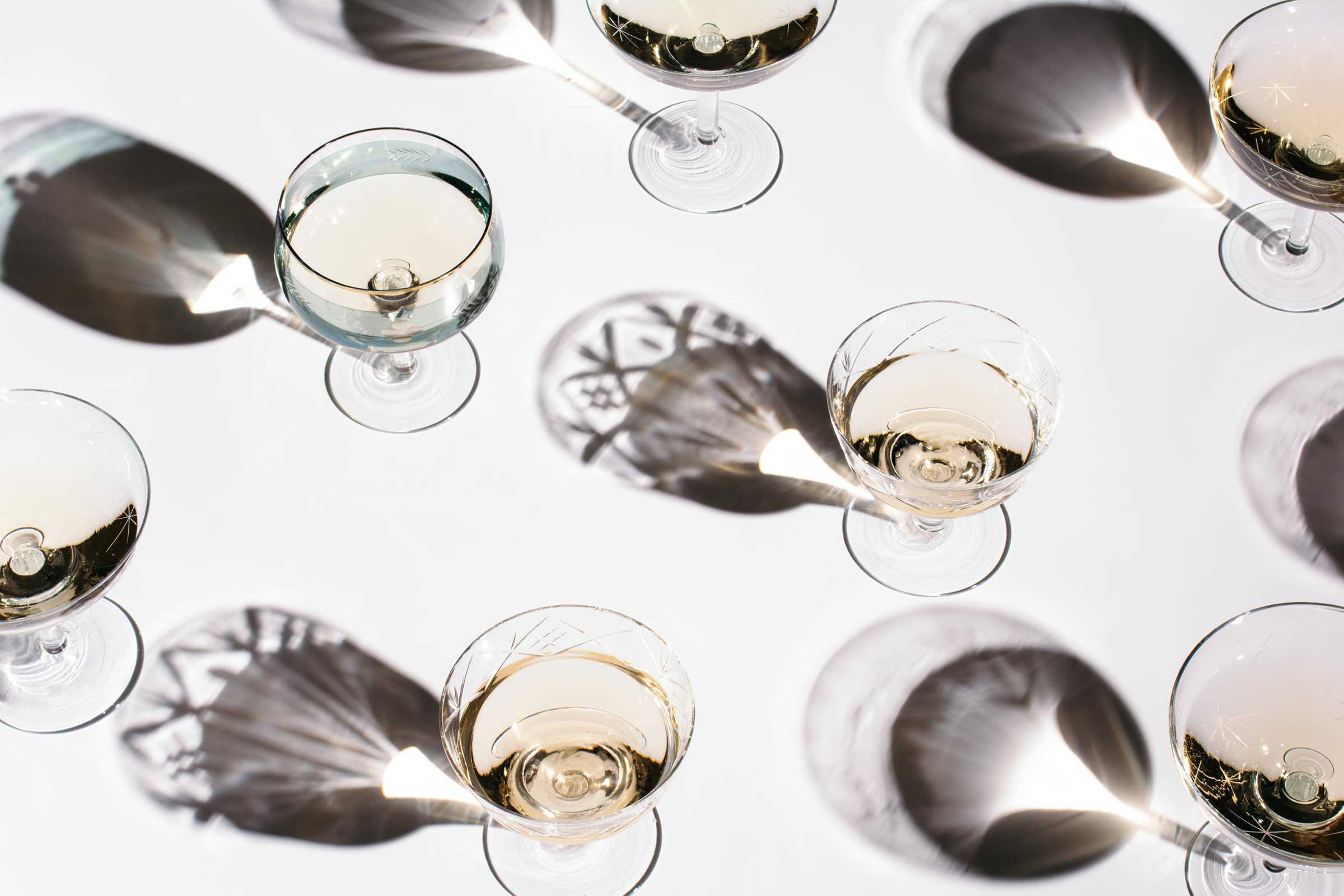 A top-down shot of glasses of chardonnay. 