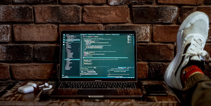 A laptop with a code editor open.