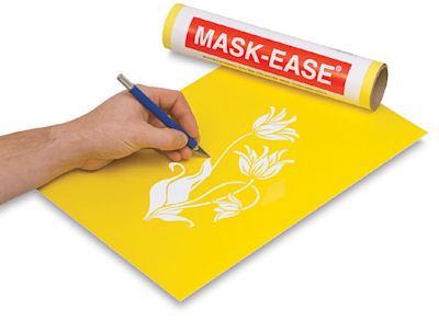 Scratch-Art Mask-Ease - Artist's hand cutting out design on Mask-Ease sheet