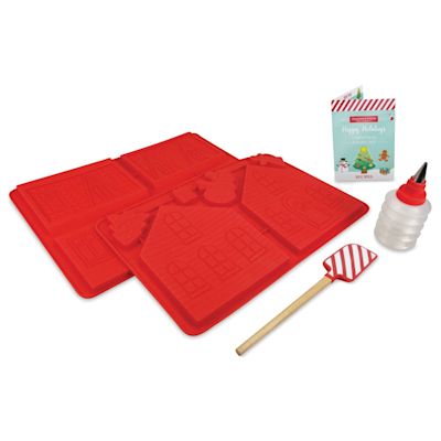 Handstand Kitchen Make Your Own Gingerbread House, laid out bakeware utensils and recipe booklet.