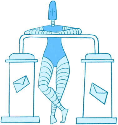 robot stands behind a cloning machine, a piece of equipment made up of two large containers connected by a tube, each with an identical letter floating inside of it