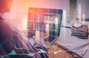 Stock Market and Man Typing