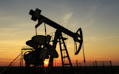 oil well with sunset