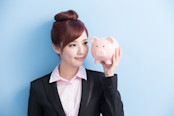 Woman Holding a Piggy Bank